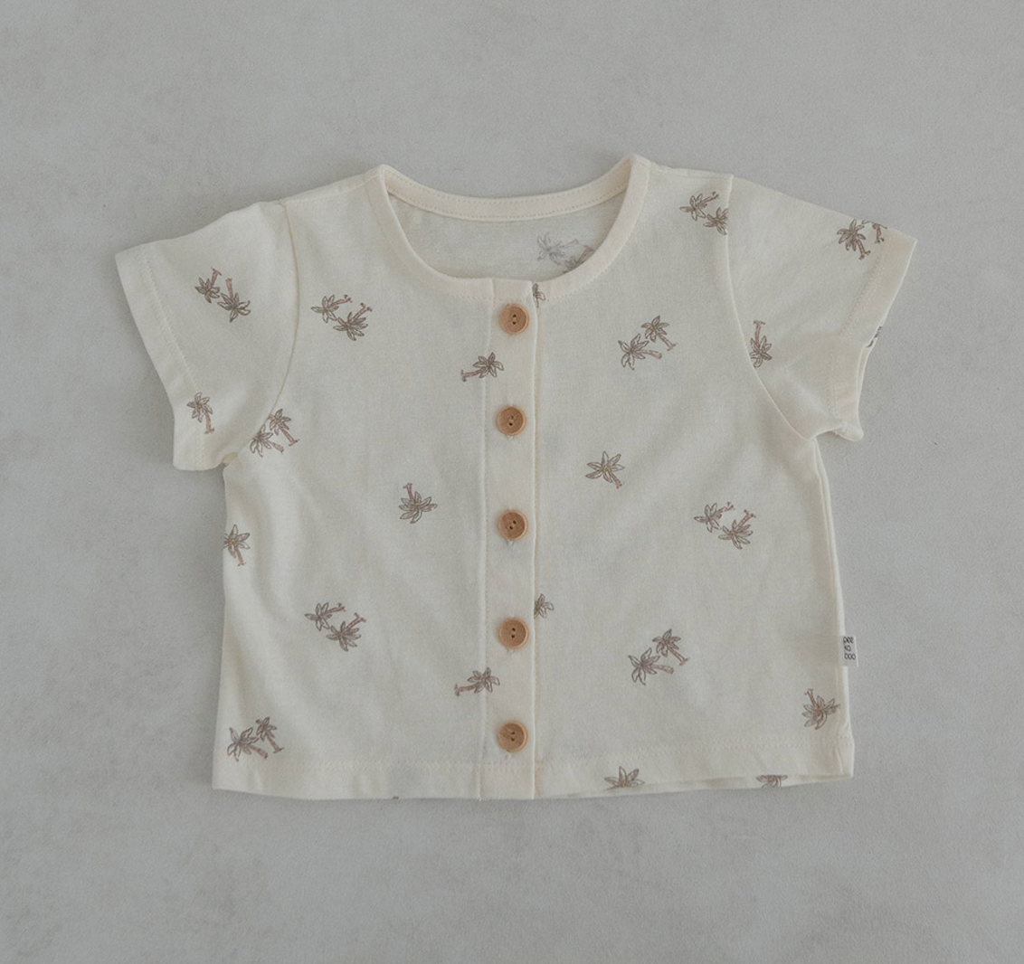 light ivroy colored cotton baby tshirt and bloomer set adorned with wooden buttons and palm tree decals