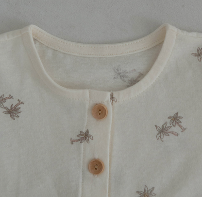 light ivroy colored cotton baby tshirt and bloomer set adorned with wooden buttons and palm tree decals