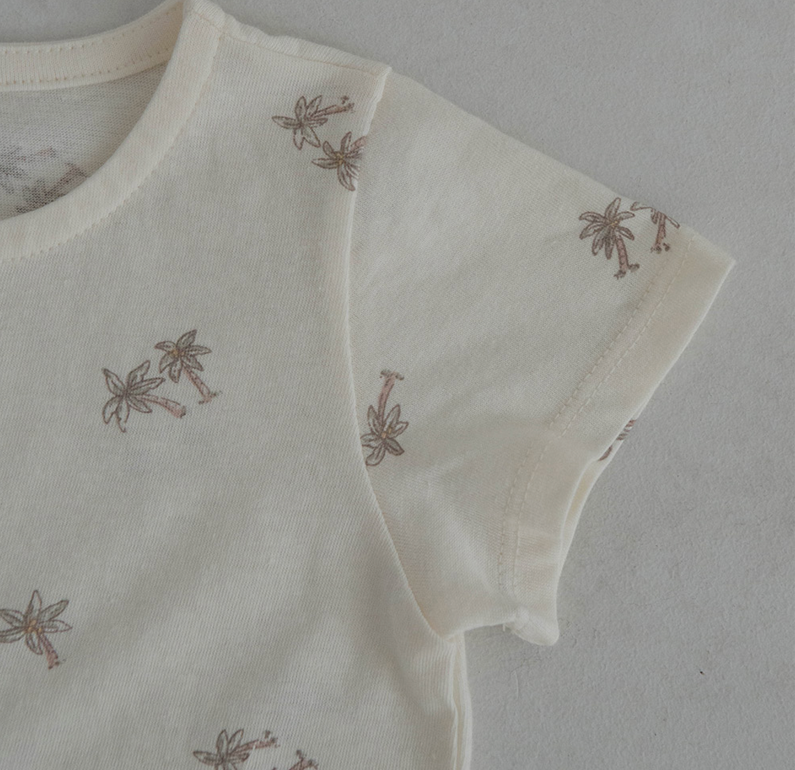 light ivroy colored cotton baby tshirt and bloomer set adorned with wooden buttons and palm tree decals