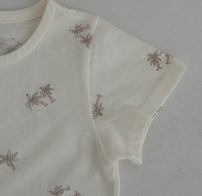 light ivroy colored cotton baby tshirt and bloomer set adorned with wooden buttons and palm tree decals